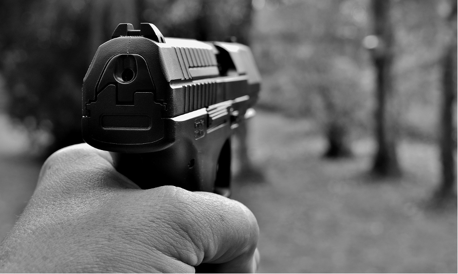 A gun owner holding a gun