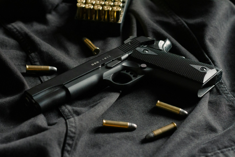 bullets around a gun | firearms